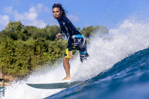 Indonesia, Bali, man surfing