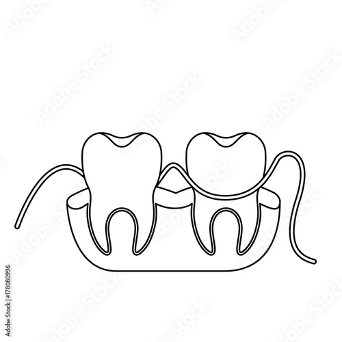 teeth and gums with dental floss between them in monochrome silhouette