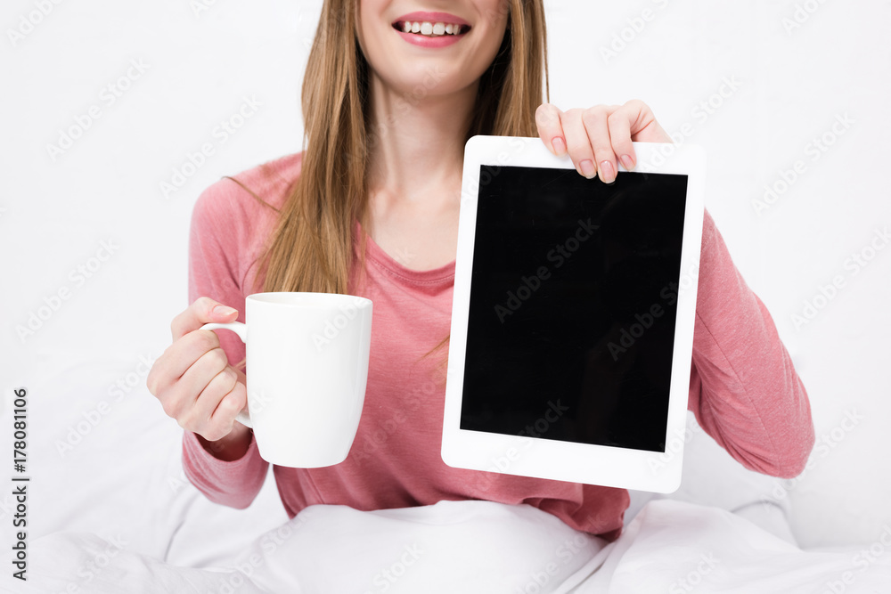 woman with coffee and tablet with blank screen woman with coffee and tablet with blank screen