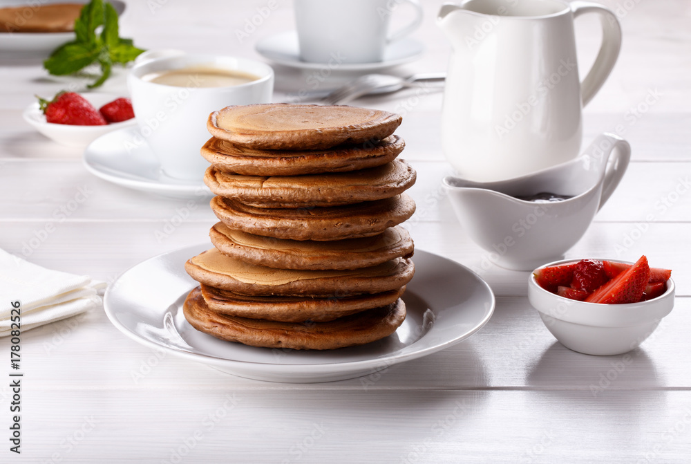 Stack of chocolate pancakes with strawberries. Stack of chocolate pancakes with strawberries.
