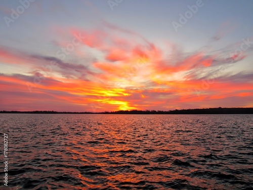 Fototapeta Naklejka Na Ścianę i Meble -  Dramatic colors at sunrise at lake Simcoe, Ontario, Canada