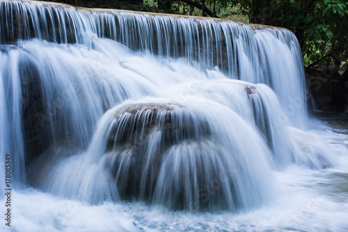 Foggy landscape of cascade at Tad Kuang si Natural waterfall in Luang prabang Laos  Asian travel.