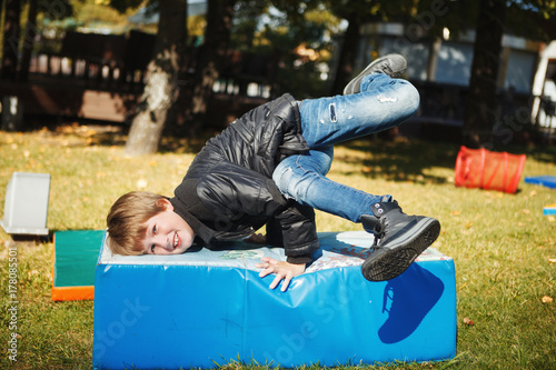 Happy boys playing fun on the Playground