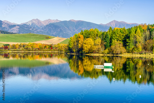 Fototapeta Naklejka Na Ścianę i Meble -  Reflection of autumn trees on lake
