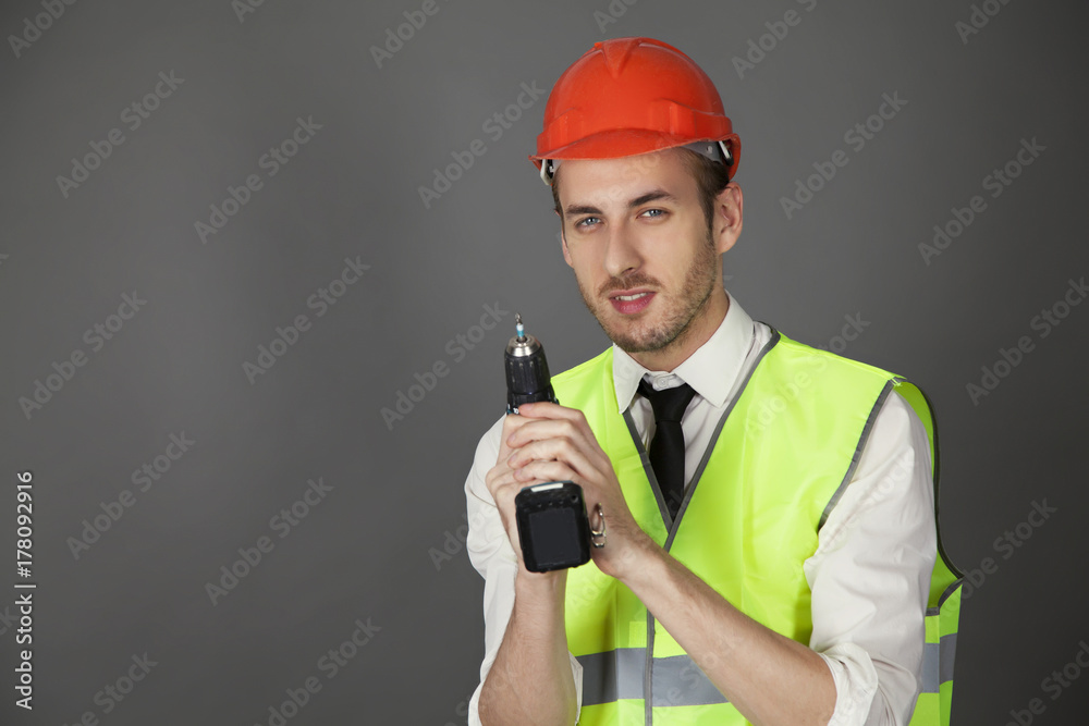 engineer in hard hat with screwdriver engineer in hard hat with screwdriver