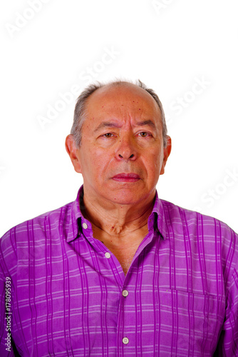 Portrait of mature man wearing a purple square t-shirt in a white background