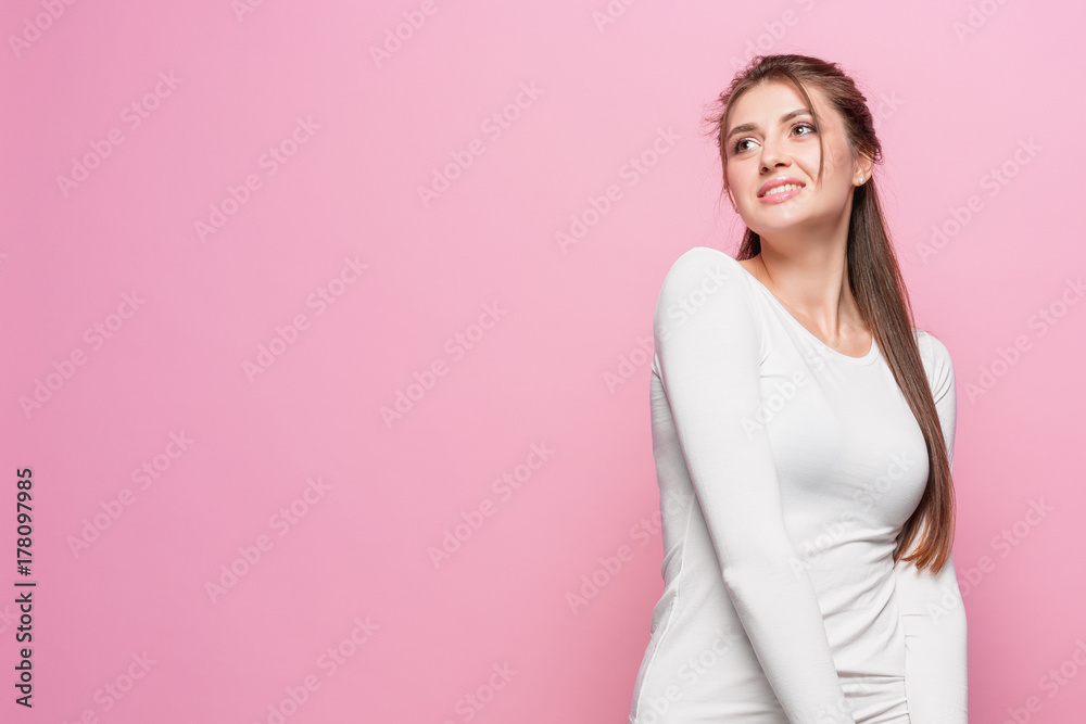 The young woman's portrait with happy emotions The young woman's portrait with happy emotions