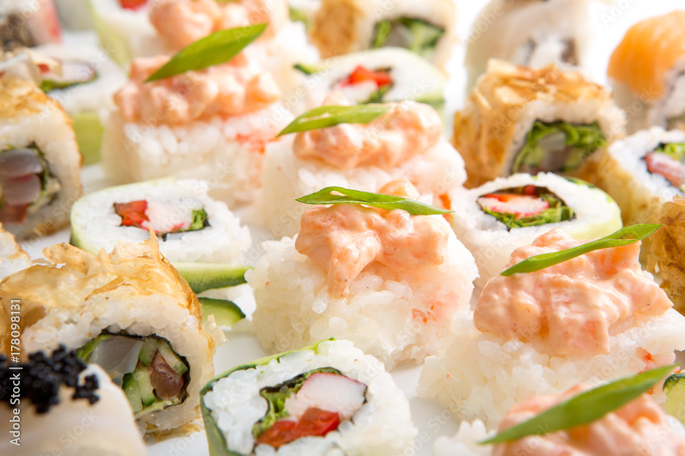 Closeup on japanese sushi rolls,maki on white background Closeup on japanese sushi rolls,maki on white background