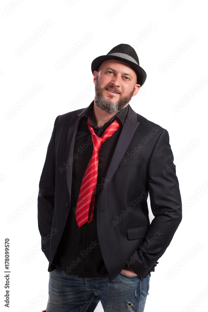 Portrait of confident bearded man with black suit, red tie and hat. People, style and fashion concept. Portrait of confident bearded man with black suit, red tie and hat. People, style and fashion concept.