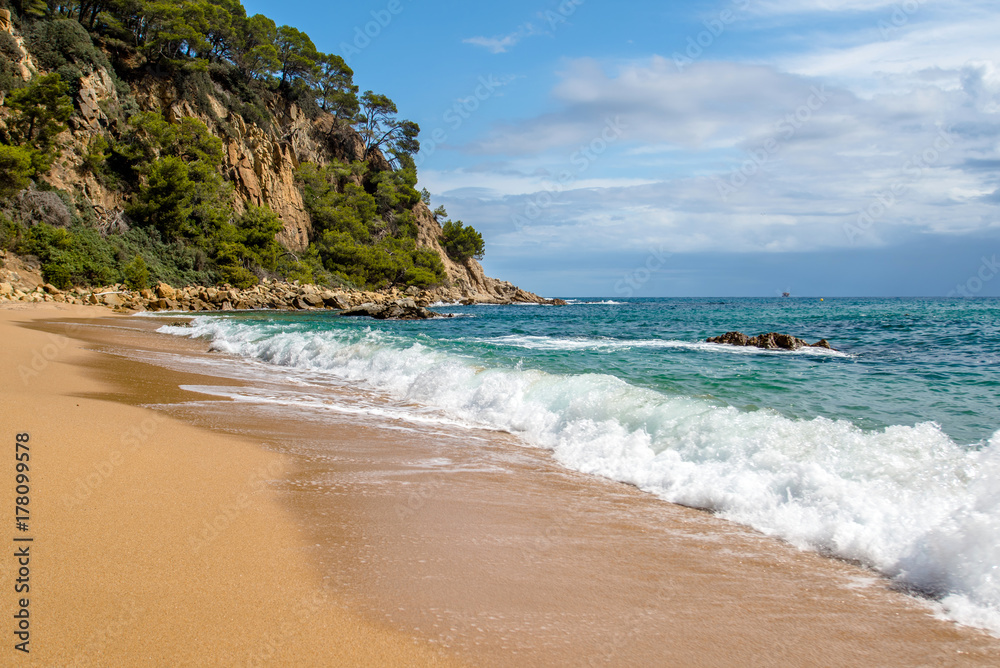 Sea surf on the beach of Santa Cristina in Lloret de Mar,Spain