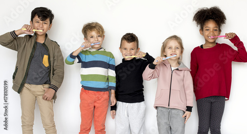 Kids brushing their teeth photo