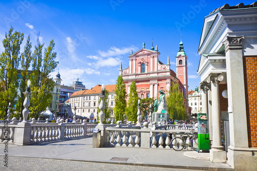 The famous "Triple Bridge" on Ljubljanica river (Ljubljana city center - Slovenia - Europe) - People are not recognizable.