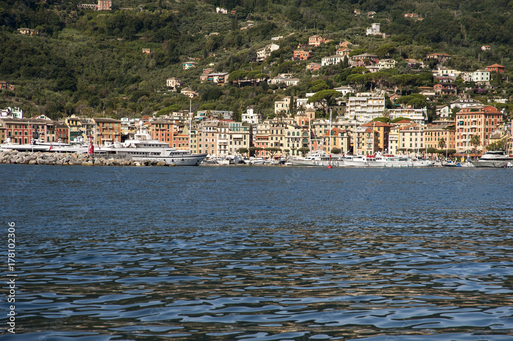 Santa Margherita Ligure, Liguria Italia -  watching the coast from the sea. the Village with the typical architecture of the houses on the harbor.