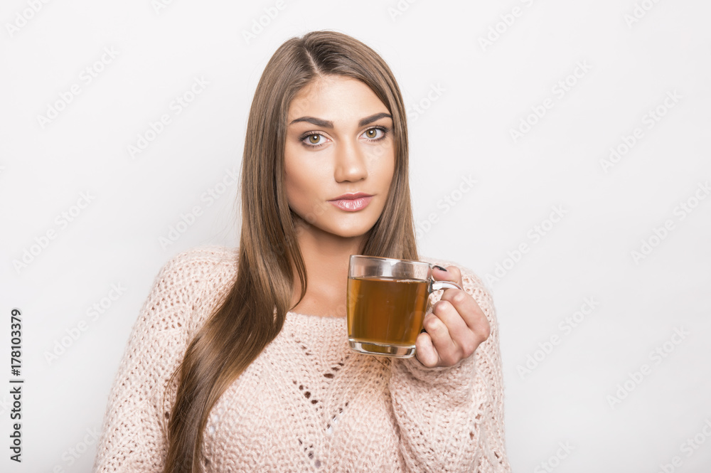 beautiful young girl enjoying warm cup of tea beautiful young girl enjoying warm cup of tea