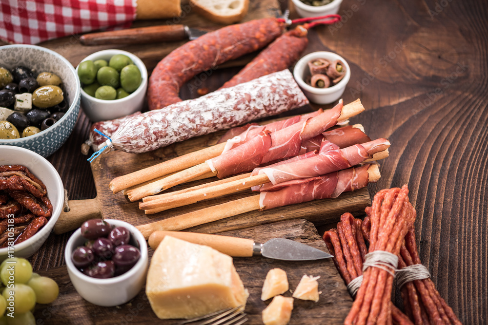 Spanish meat selection on wooden table Spanish meat selection on wooden table