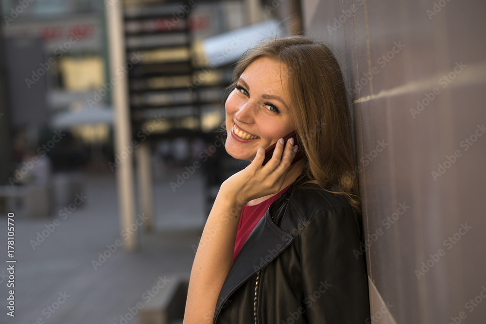 Beautiful young woman calling by phone