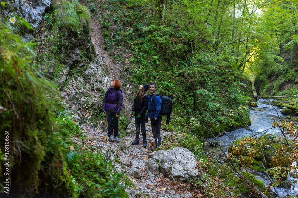 Tourists hiking on a trail Tourists hiking on a trail