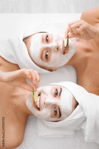 Young women with facial mas...