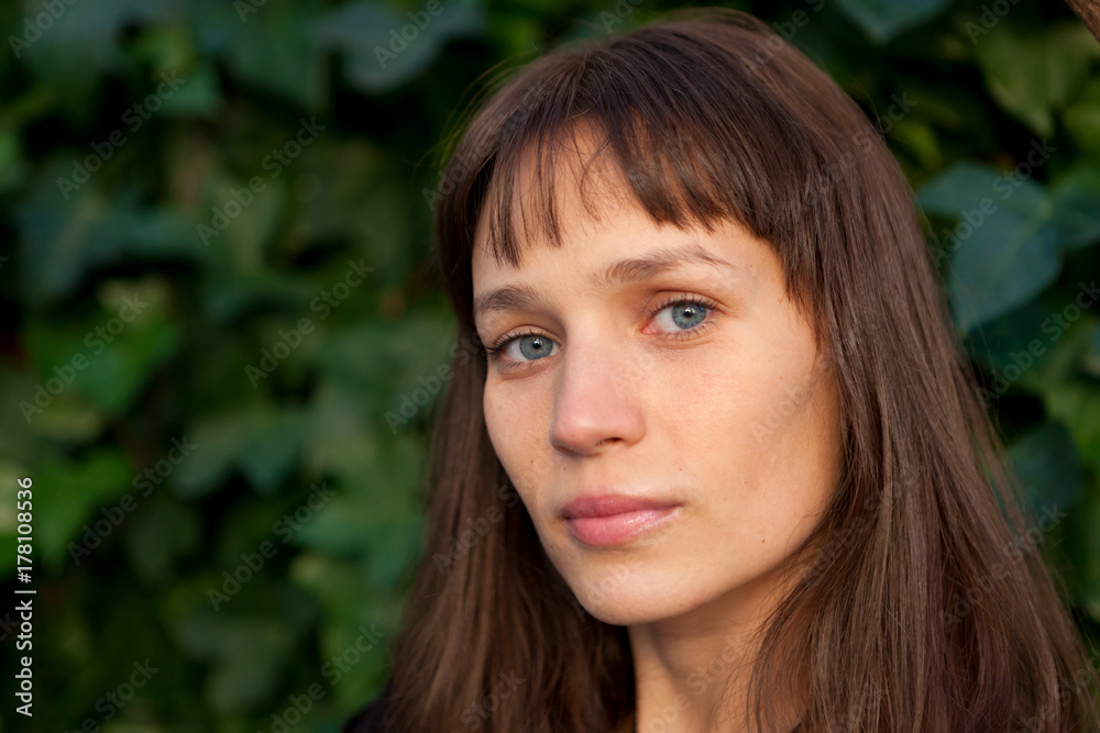 Beautiful woman with blue eyes in the park Beautiful woman with blue eyes in the park