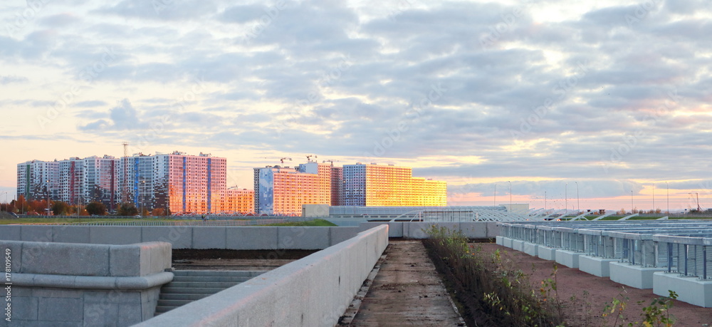 panoramas of city quarters on the beach at sunset