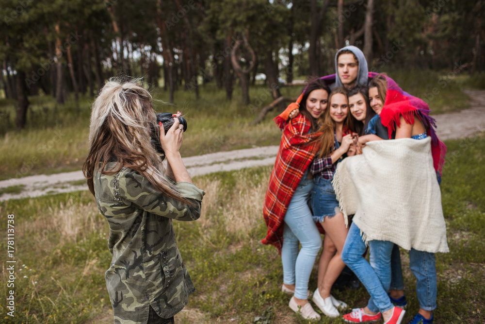 Friends warm together photoshoot nature concept. Tourist lifestyle. Happy team on the nature. Friends warm together photoshoot nature concept. Tourist lifestyle. Happy team on the nature.