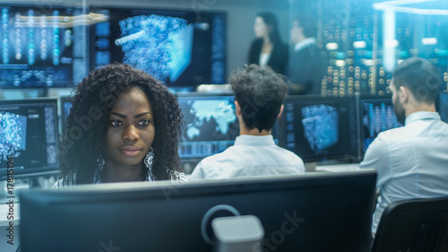 Computer engineer working on neural network / AI project in office photo