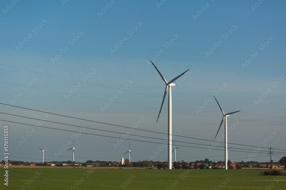 Wind generator on a background of sunset sky. Clean energy concept Wind generator on a background of sunset sky. Clean energy concept