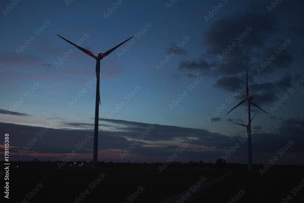 Obraz premium Wind turbine in the evening. Clean energy concept. 