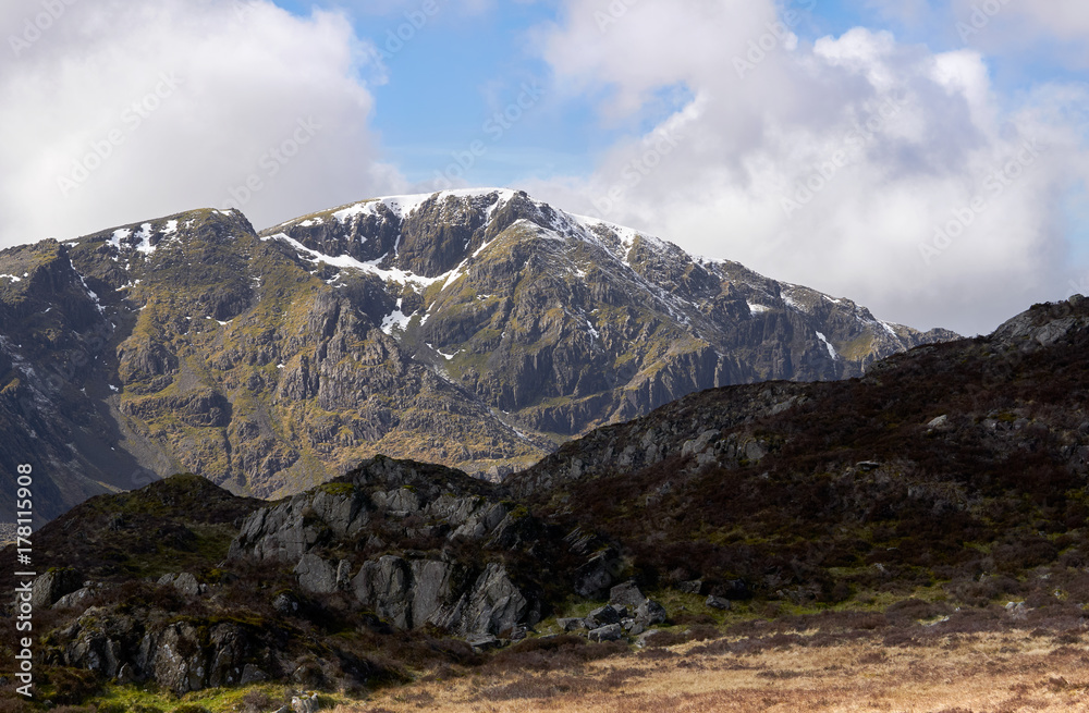 Fototapeta premium The snow covered summit of Pillar on a sunny winters day in the English Lake District.