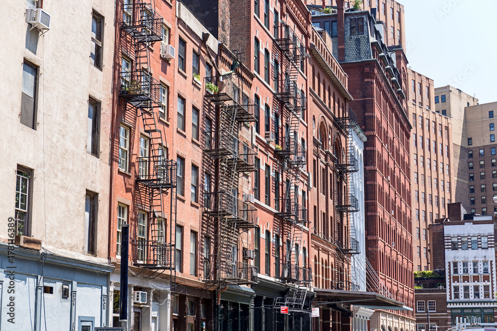 Typical old houses with facade stairs in TRibeca, NYC, USA