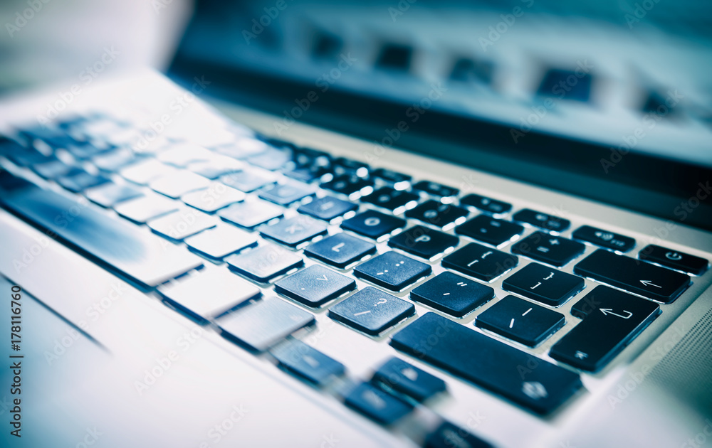 Close up, abstract image of a laptop, computer keyboard. Close up, abstract image of a laptop, computer keyboard.