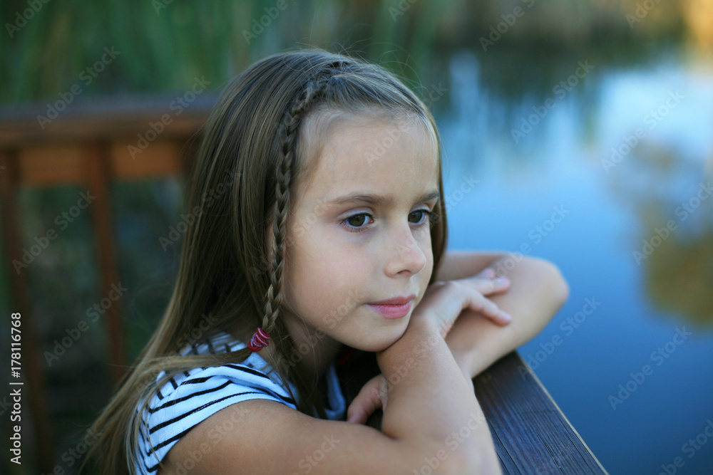 Pretty Girl Looking Out Over A Pond On An Autumn Evening Pretty Girl Looking Out Over A Pond On An Autumn Evening
