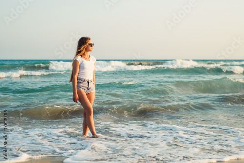 Girl With Long Hair on the background of the sea sunset   © Shadow
