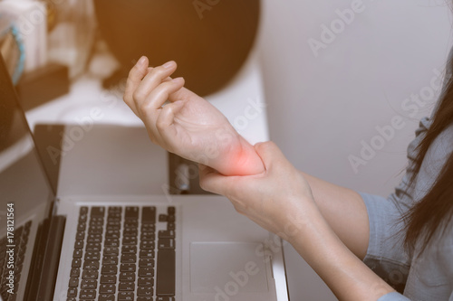 Young woman is injury from office syndrome symptom