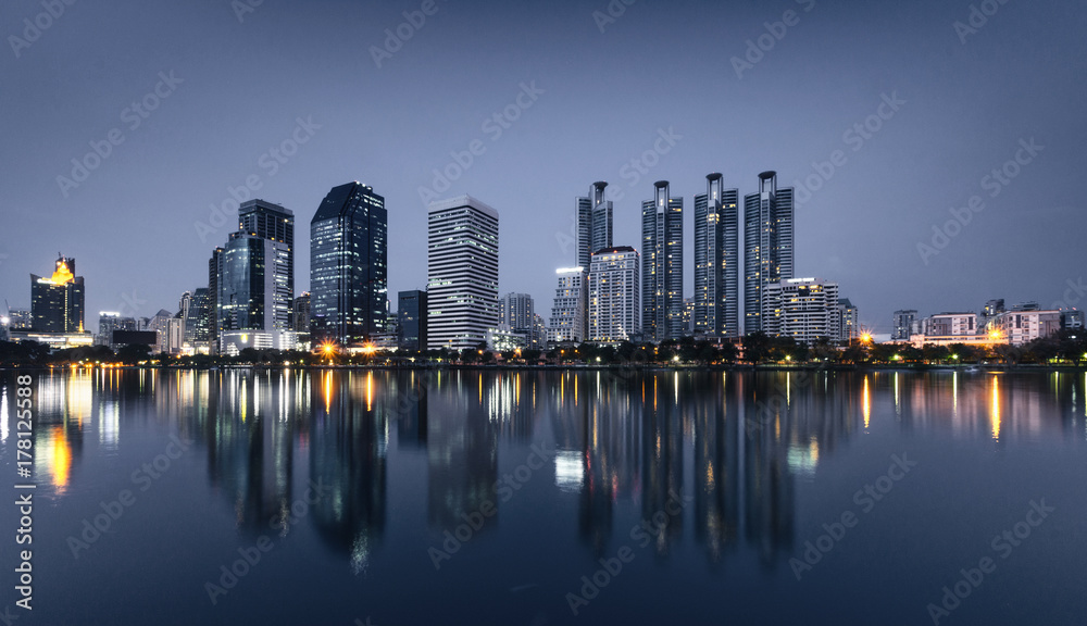light from modern building bright in night city with skyline. night cityscape concept.