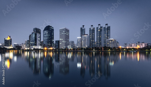 light from modern building bright in night city with skyline. night cityscape concept.