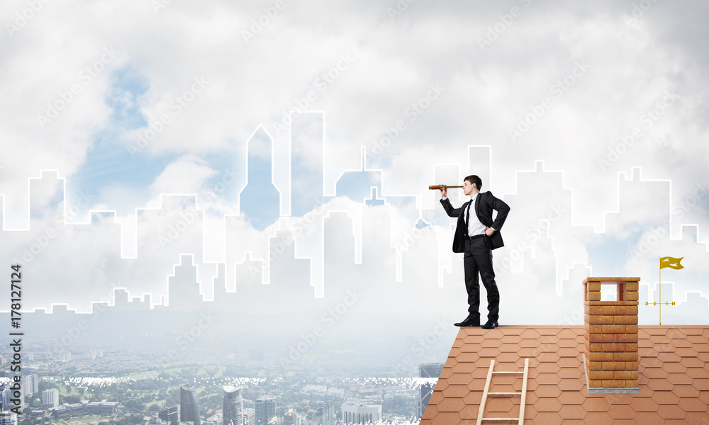 Engineer man standing on roof and looking in spyglass. Mixed media Engineer man standing on roof and looking in spyglass. Mixed media