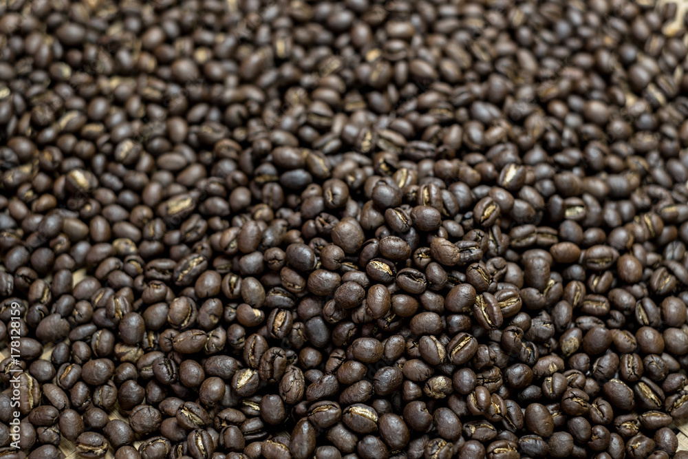 Depth of field shot, soft focus, Medium dark Roasted peaberry coffee beans background. Depth of field shot, soft focus, Medium dark Roasted peaberry coffee beans background.