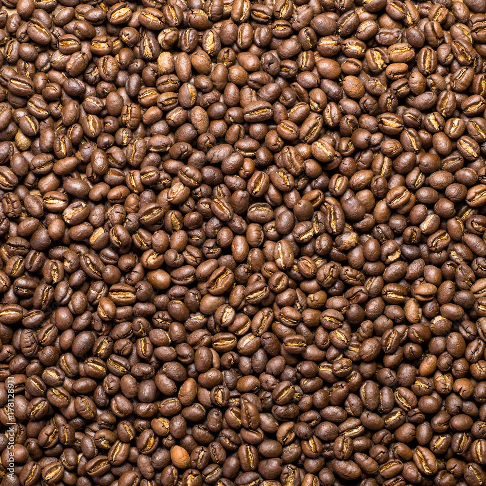 Fototapeta premium Flay lay style, Medium dark Roasted peaberry coffee beans on bamboo handcraft background.
