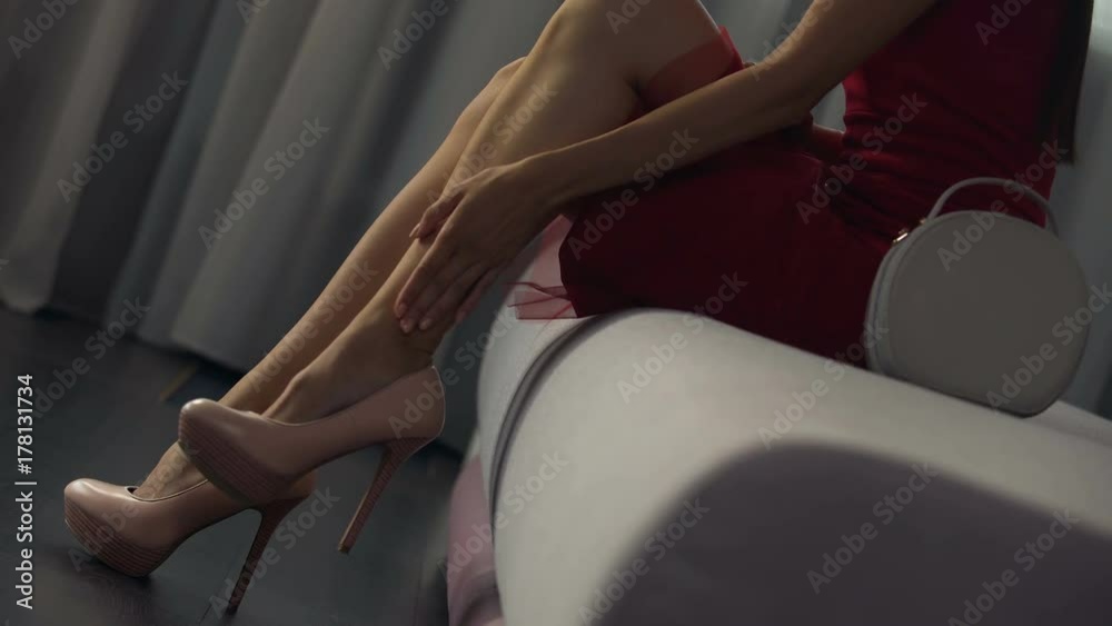 Satisfied woman ready for night out after painless epilation, hygiene product Satisfied woman ready for night out after painless epilation, hygiene product