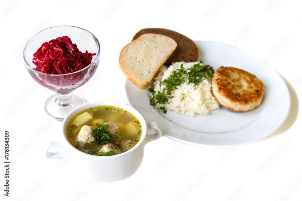 Business lunch. Soup, salad, cutlet with rice and bread isolated on white background