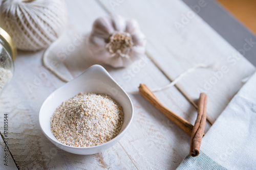 toasted herb rice on a white setting with garlic, cinnamon sticks