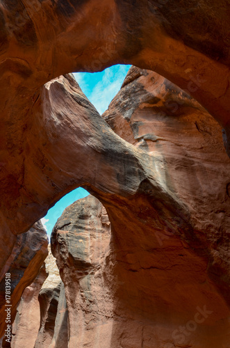 blue sky through the natural arches in Spooky Slot Canyon Hole in the Rock Road, Grand Staircase Escalante National Monument, Garfield County, Utah, USA