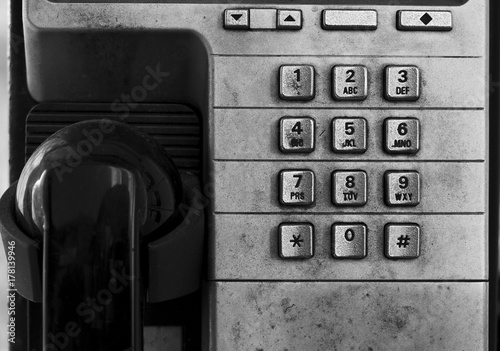 Closeup of Dirty and Obsolete Telephone Booth