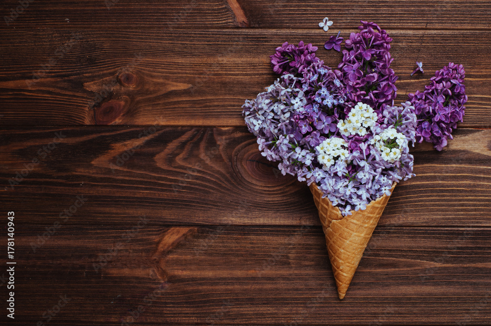 Ice cream waffle cones with lilac flowers
