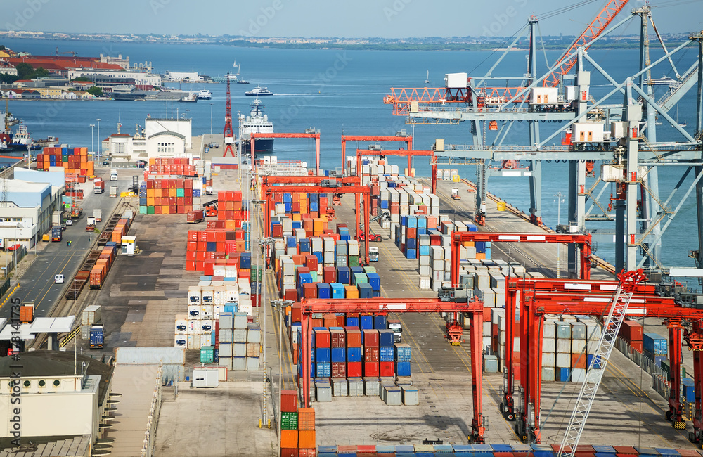 Industrial sea port with containers and cranes.
