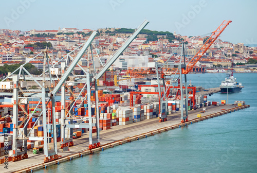 Industrial sea port with containers and cranes.