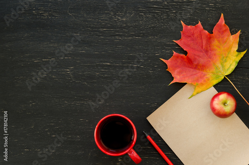 Autumn maple leaf, apple, cup of tea, paper for text and pencil