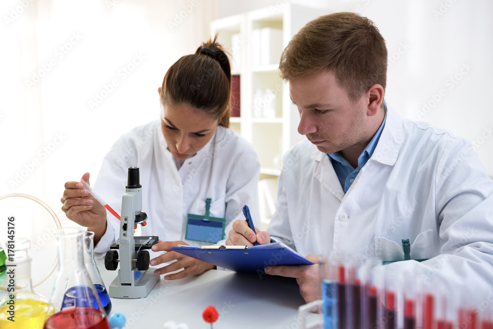 Young scientists making test or research in school lab Young scientists making test or research in school lab