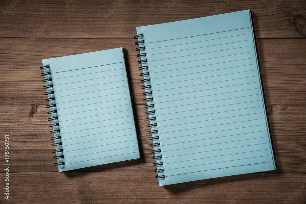 blank notebook on brown wood table blank notebook on brown wood table